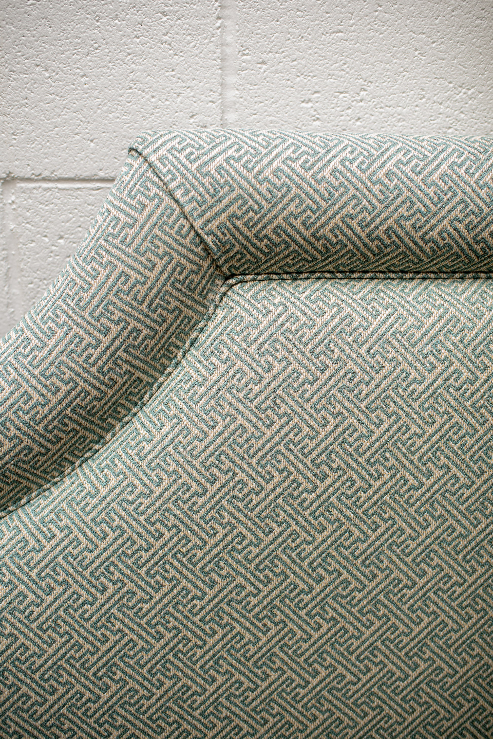 Queen upholstered headboard in green and cream Kravet Fabric by Winston's Collection