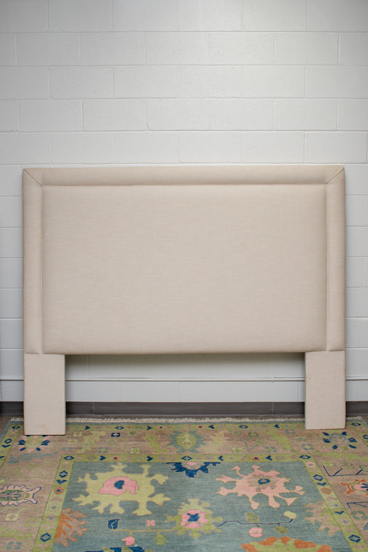 King upholstered headboard in a neutral fabric by Winston's Collection