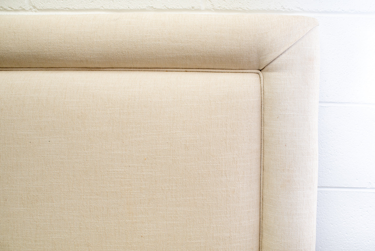 King upholstered headboard in a neutral fabric by Winston's Collection