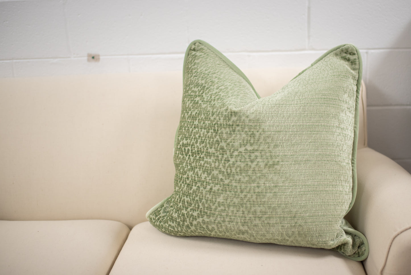 Green animal print cut velvet pillow