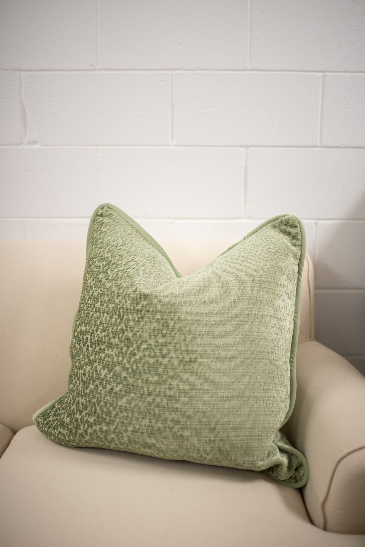 Green animal print cut velvet pillow