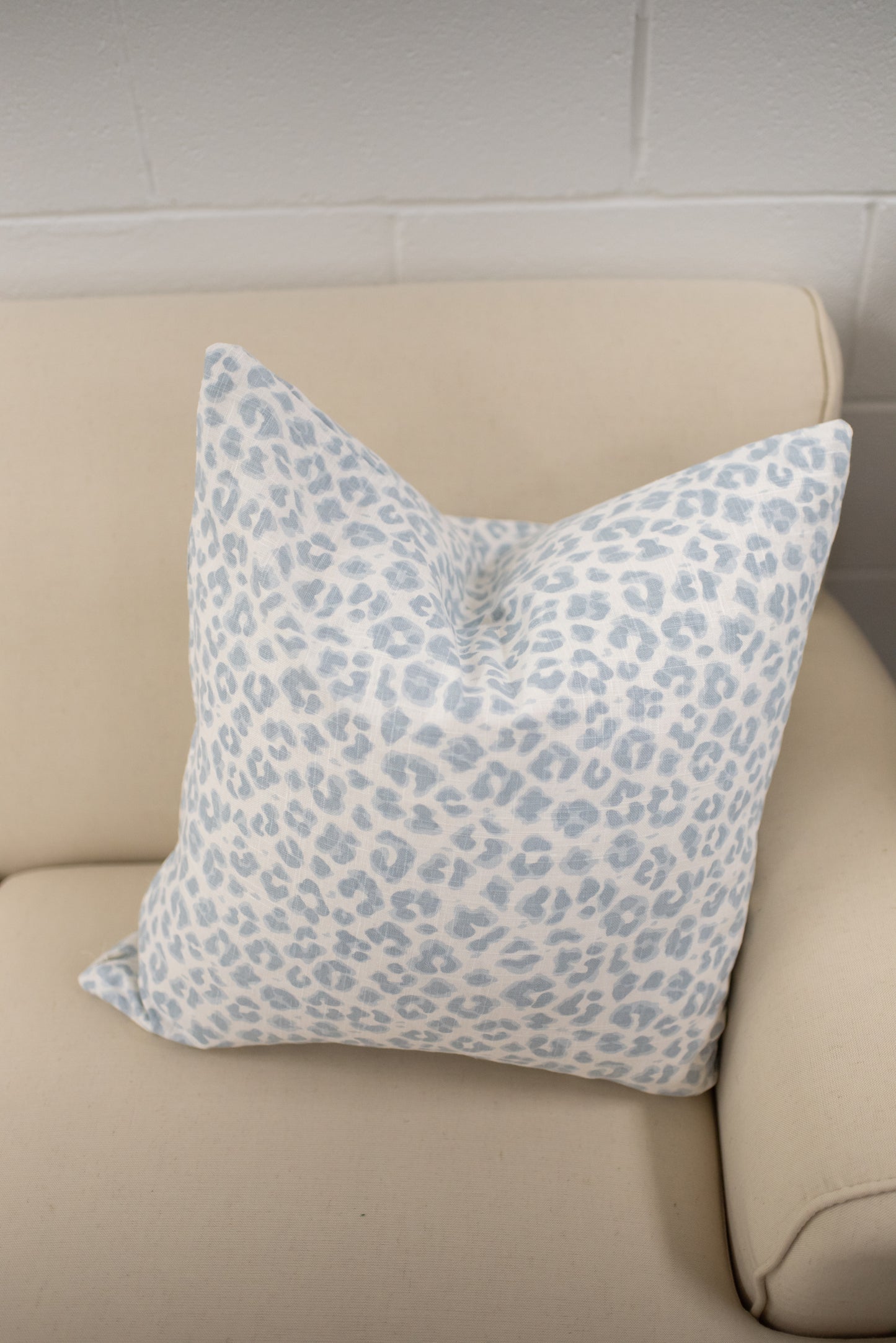 white and blue animal print leopard pillow