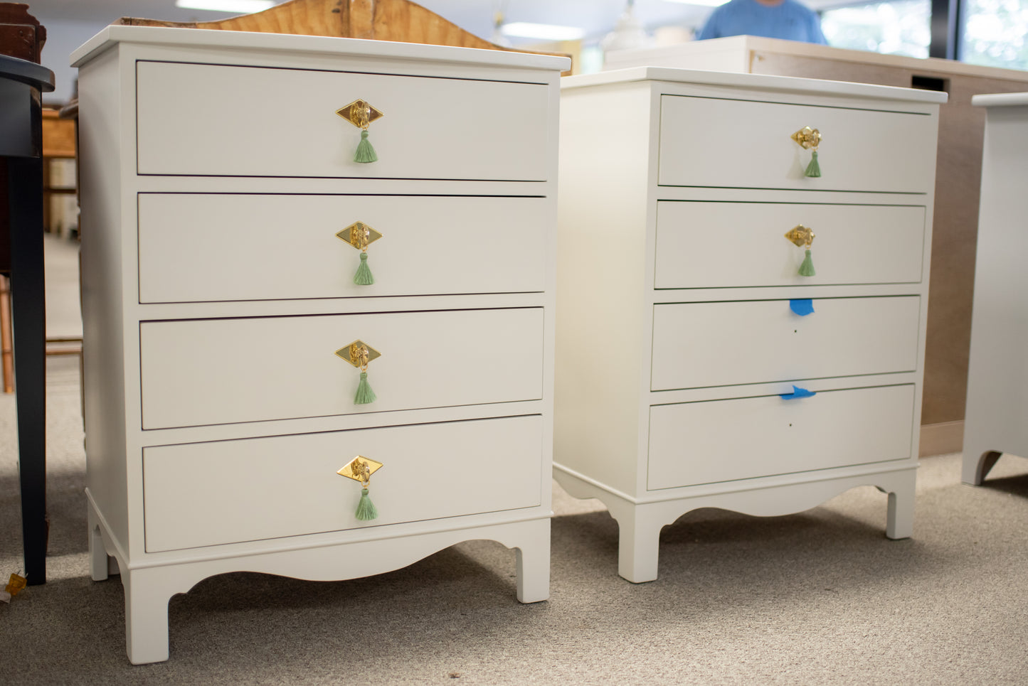 Pair of white dove nightstands with green tassel pulls