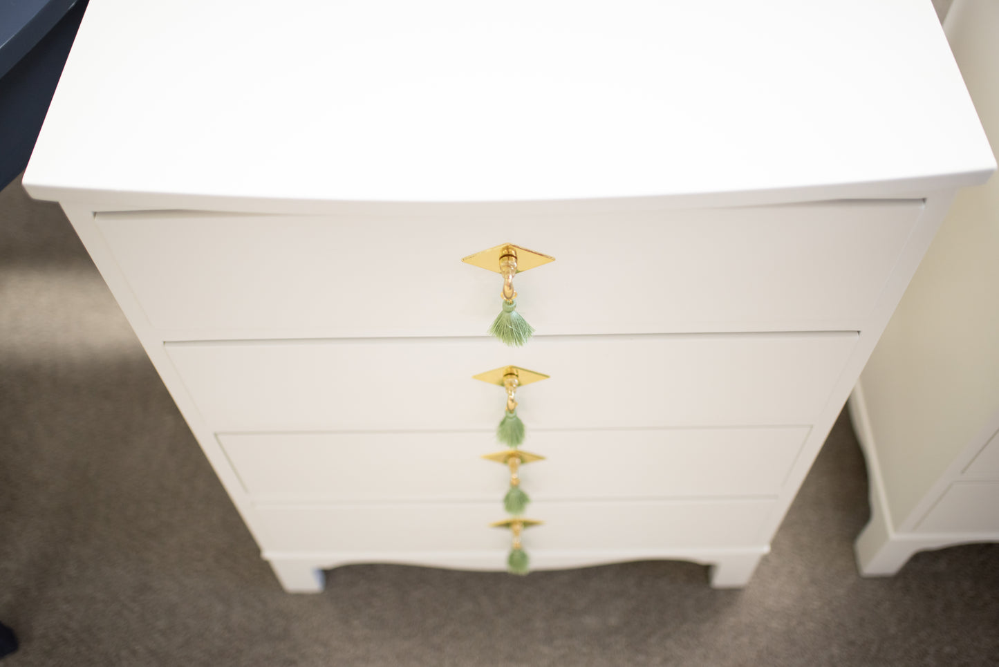 Pair of white dove nightstands with green tassel pulls