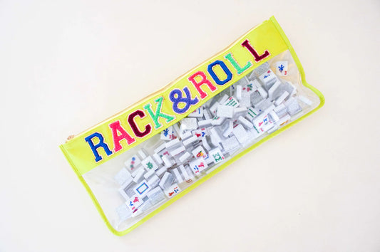 Neon yellow top and outer lined clear bag with blue, pink, dark red and teal lettering that reads Rack & Roll filled with Mahjong game pieces.