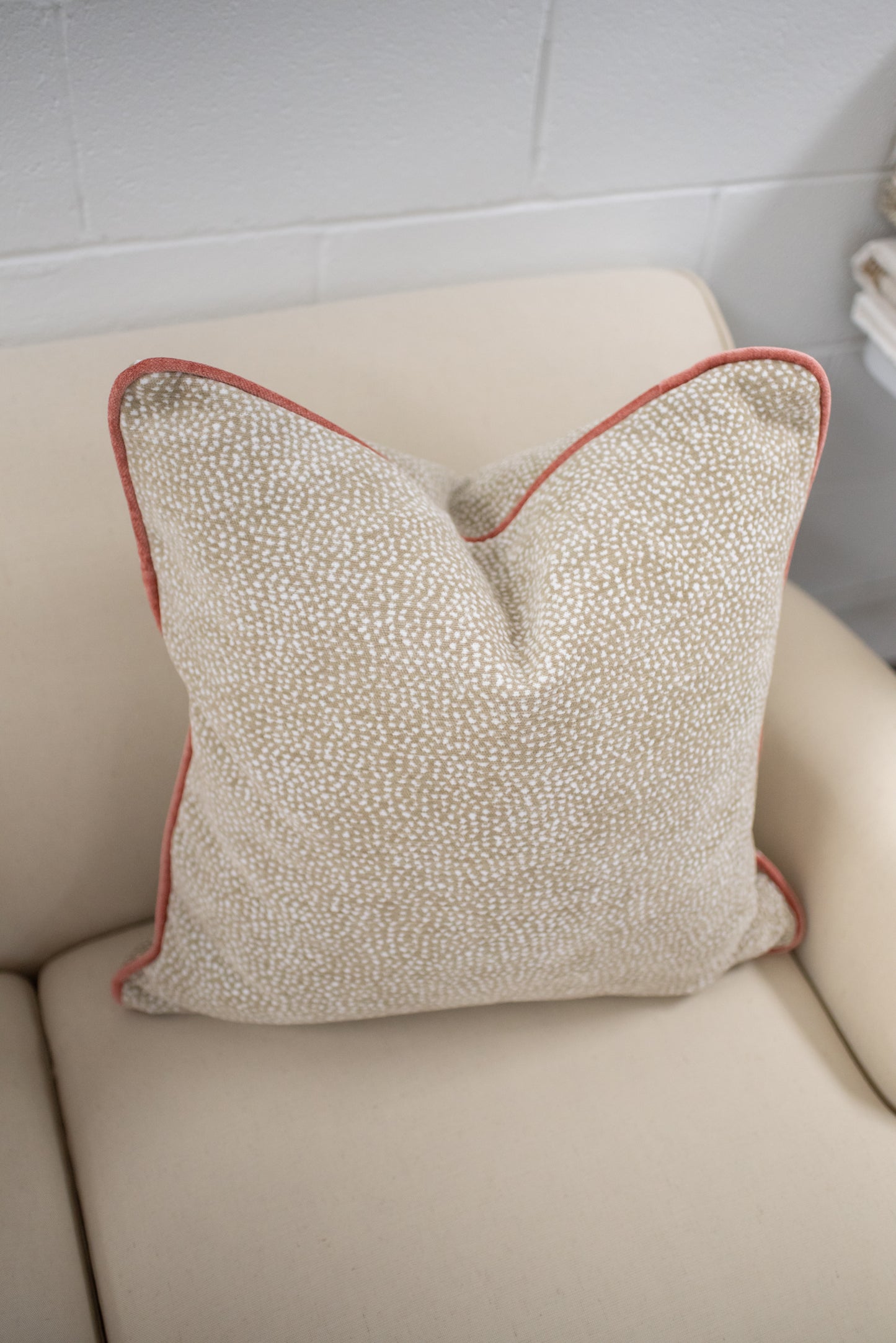 Chenille dot pillow with coral welting