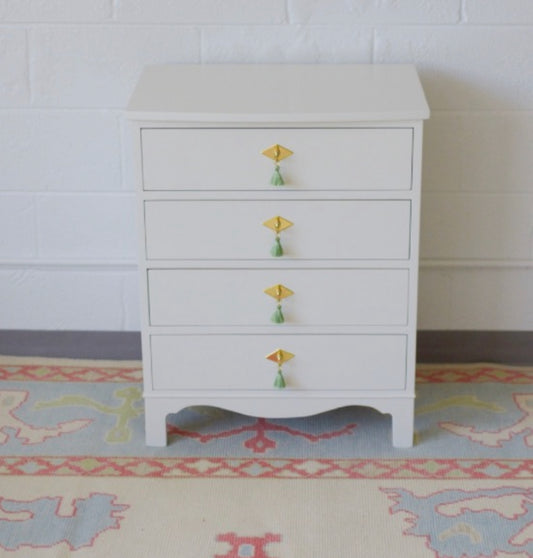 Pair of white dove nightstands with green tassel pulls