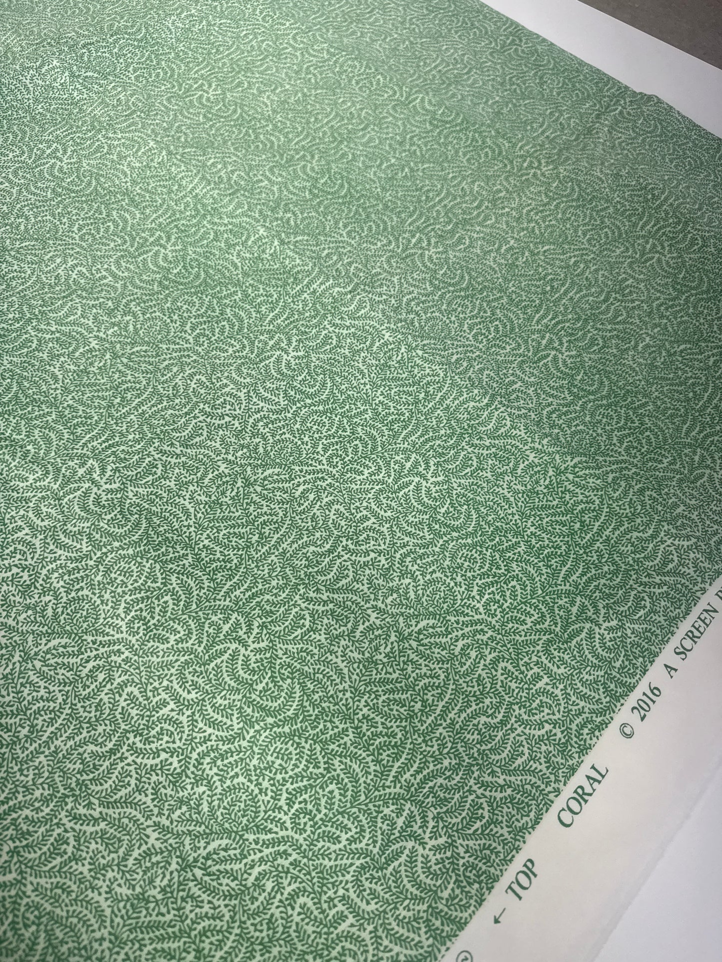 Soane Britain, coral, green, by the yard